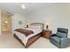 Spacious main bedroom features a ceiling fan, and comfortable seating and bedroom furniture at 7574 Camden Harbour Dr, Bradenton, FL 34212