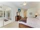 Spacious main bedroom with ceiling fan and slider door to the lanai at 7574 Camden Harbour Dr, Bradenton, FL 34212