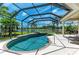 Inviting pool and spa in a screened lanai, perfect for relaxing and enjoying beautiful water views at 7574 Camden Harbour Dr, Bradenton, FL 34212