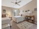 Cozy bedroom features two twin beds, neutral walls, plush carpeting, and a ceiling fan at 7724 Palm Aire Ln, Sarasota, FL 34243