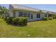Home exterior showing manicured lawn and tidy landscaping at 7724 Palm Aire Ln, Sarasota, FL 34243
