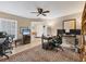 Bright office space featuring a patterned rug, multiple desks, and a view to the front entrance at 7724 Palm Aire Ln, Sarasota, FL 34243