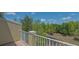 Balcony overlooking a serene landscape filled with lush trees, providing a tranquil outdoor retreat at 9008 White Sage Loop # 3605, Lakewood Ranch, FL 34202