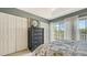 Bright bedroom featuring a tall dresser, lots of closet space, and balcony access at 9008 White Sage Loop # 3605, Lakewood Ranch, FL 34202