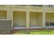 Charming entryway of a unit featuring a private entrance with a cozy seating area and adjacent AC unit at 9008 White Sage Loop # 3605, Lakewood Ranch, FL 34202