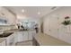 Open-concept kitchen showcasing granite counters, stainless steel appliances and a seamless transition to the living area at 9008 White Sage Loop # 3605, Lakewood Ranch, FL 34202
