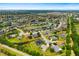 Aerial view of the community, highlighting lush landscaping, and a lake at 9101 Yarberry St, Sarasota, FL 34240