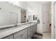 Elegant bathroom featuring double sinks, vanity, and a large mirror at 9101 Yarberry St, Sarasota, FL 34240