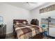 Bedroom with wood floors and ceiling fan at 9101 Yarberry St, Sarasota, FL 34240