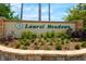 Attractive stone sign and landscaping at the entrance to Laurel Meadows at 9101 Yarberry St, Sarasota, FL 34240