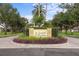 The Laurel Meadows community sign sits surrounded by lush landscaping and beautiful trees at 9101 Yarberry St, Sarasota, FL 34240