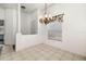 Classic dining room featuring a chandelier and neutral tile flooring at 9101 Yarberry St, Sarasota, FL 34240