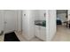 Inviting entryway featuring a decorative nook with a countertop and storage at 9101 Yarberry St, Sarasota, FL 34240