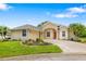Well-maintained single Gathering home has a manicured lawn, mature palms, and a red front door at 9101 Yarberry St, Sarasota, FL 34240