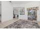 Bright living room features light tile flooring and sliding glass doors leading to the outdoors at 9101 Yarberry St, Sarasota, FL 34240