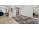 Bright living room with light tile flooring, and sliding glass doors leading to the outdoors at 9101 Yarberry St, Sarasota, FL 34240