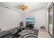 Cozy living room with modern rug, fan and sliding glass door for natural light at 9101 Yarberry St, Sarasota, FL 34240