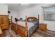 Comfortable main bedroom with plush bed, side table and lots of natural light at 9101 Yarberry St, Sarasota, FL 34240
