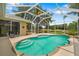 Screened in pool and lanai with palm trees, a lake, and outdoor seating at 9101 Yarberry St, Sarasota, FL 34240