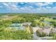 Scenic aerial view of the community showcasing tennis courts, pool, golf course, and lush landscaping at 9734 Carnoustie Pl, Bradenton, FL 34211