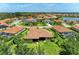 Stunning aerial view of houses in a beautiful community near a lake and nature preserve at 9734 Carnoustie Pl, Bradenton, FL 34211