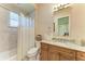 Bathroom with a shower-tub combo and stylish vanity at 9734 Carnoustie Pl, Bradenton, FL 34211