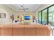 Spacious living room with modern decor and large sliding doors for ample natural light at 9734 Carnoustie Pl, Bradenton, FL 34211
