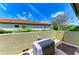 Private outdoor patio with a tiled roof, offering a relaxed space with an AC unit at 9734 Carnoustie Pl, Bradenton, FL 34211