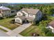 Two-story home with well-kept lawn, two car garage and screened in porch overlooking a pond at 13116 Bliss Loop, Bradenton, FL 34211