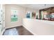 Bright entryway featuring hardwood floors and natural light streaming through the windows at 13116 Bliss Loop, Bradenton, FL 34211