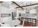 Spacious open concept kitchen with seating at island, stainless appliances, hardwood floors and dining table at 13116 Bliss Loop, Bradenton, FL 34211