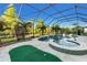 Screened-in pool and spa area, putting green and scenic water view at 13116 Bliss Loop, Bradenton, FL 34211