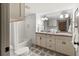 Spacious bathroom features a tub-shower combo, double sink vanity, and tile floors at 101 66Th St # 1, Holmes Beach, FL 34217