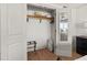 This closet features a wooden rack, safe, and storage with the door open and a mirror on the door at 101 66Th St # 1, Holmes Beach, FL 34217