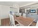 Dining room with seating for six with open sightlines to the kitchen and living room at 101 66Th St # 1, Holmes Beach, FL 34217