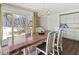 Dining room with seating for four featuring bright, natural light and modern light fixture at 101 66Th St # 1, Holmes Beach, FL 34217