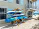 Charming exterior of beachside property with kayak storage, convenient beach access, and inviting coastal ambiance at 101 66Th St # 1, Holmes Beach, FL 34217