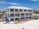 Gorgeous condo featuring a spacious deck with seating area, perfect for enjoying beachfront living at 101 66Th St # 1, Holmes Beach, FL 34217