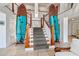 Welcoming foyer featuring elegant staircase and unique decor, adding coastal charm to the building at 101 66Th St # 1, Holmes Beach, FL 34217