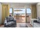 Cozy living room with beach views, comfortable seating, and a seamless indoor-outdoor flow at 101 66Th St # 1, Holmes Beach, FL 34217