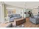 Open concept living room leads into a dining room with ocean views and light colored cabinets at 101 66Th St # 1, Holmes Beach, FL 34217
