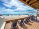 Relaxing patio featuring comfortable seating and an umbrella for shade on sunny beach days at 101 66Th St # 1, Holmes Beach, FL 34217