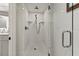This is a walk-in shower with white subway tiles and a glass door at 101 66Th St # 1, Holmes Beach, FL 34217