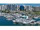Stunning aerial view showcasing a marina with yachts and waterfront condos in a vibrant city setting at 101 S Gulfstream Ave # 5J, Sarasota, FL 34236