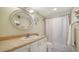 Clean bathroom with a shower and vanity with an oval mirror at 101 S Gulfstream Ave # 5J, Sarasota, FL 34236