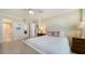 Bedroom has white bedding, neutral walls, and attached bathroom at 101 S Gulfstream Ave # 5J, Sarasota, FL 34236