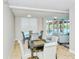 Community game room with seating for table games and access to pool views at 101 S Gulfstream Ave # 5J, Sarasota, FL 34236