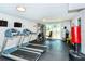 Community gym with treadmills, weight machines, and a view of the pool at 101 S Gulfstream Ave # 5J, Sarasota, FL 34236