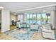 Clubhouse lounge area with plush seating, pool views, and modern lighting at 101 S Gulfstream Ave # 5J, Sarasota, FL 34236