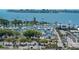 Elevated view featuring a marina with yachts, lush greenery, and cityscape in the backdrop at 101 S Gulfstream Ave # 5J, Sarasota, FL 34236